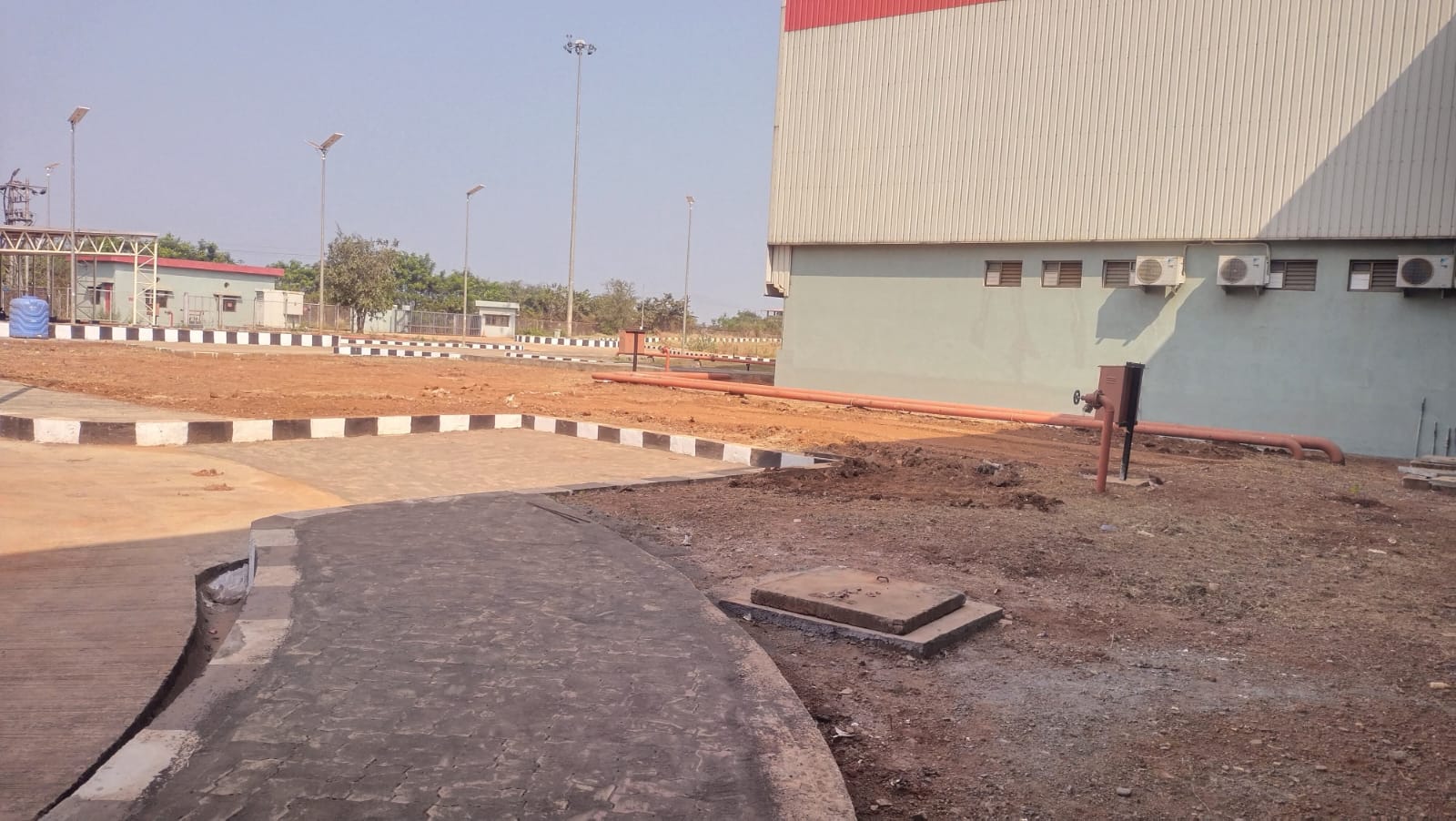 Commercial Site Before Landscaping — Barren Land Transformation